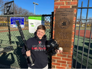 Avery with some of his donated equipment while visiting the Kelley Cares Miracle Field 