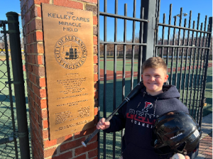 Avery with some of his donated equipment while visiting the Kelley Cares Miracle Field 