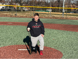 Avery with some of his donated equipment while visiting the Kelley Cares Miracle Field 